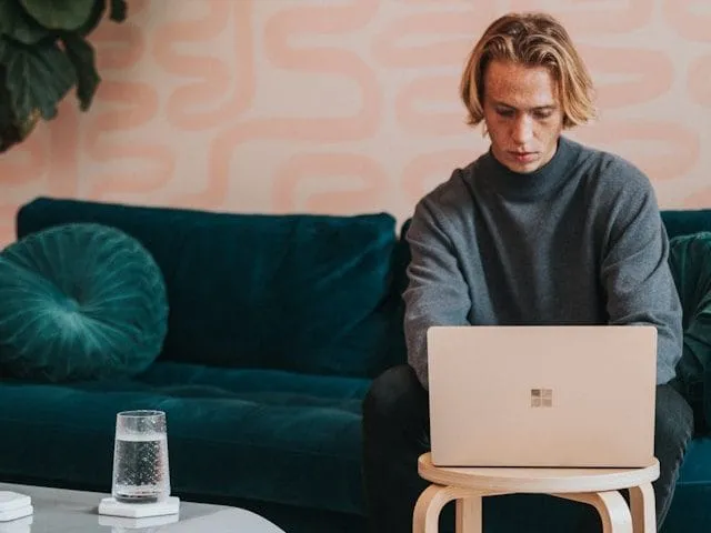A business owner receiving qualified leads on their computer through B2B SEO.