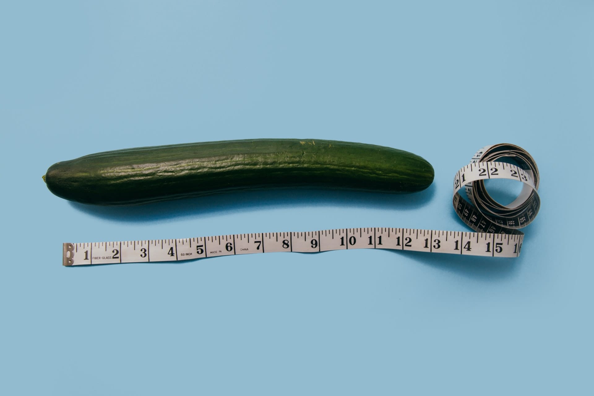 Cucumber with measuring tape symbolizes growth, reflecting how an SEO agency for startups boosts visibility and success.