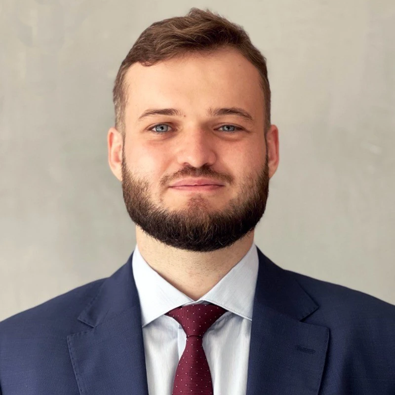 The headshot of Gregory Shein.