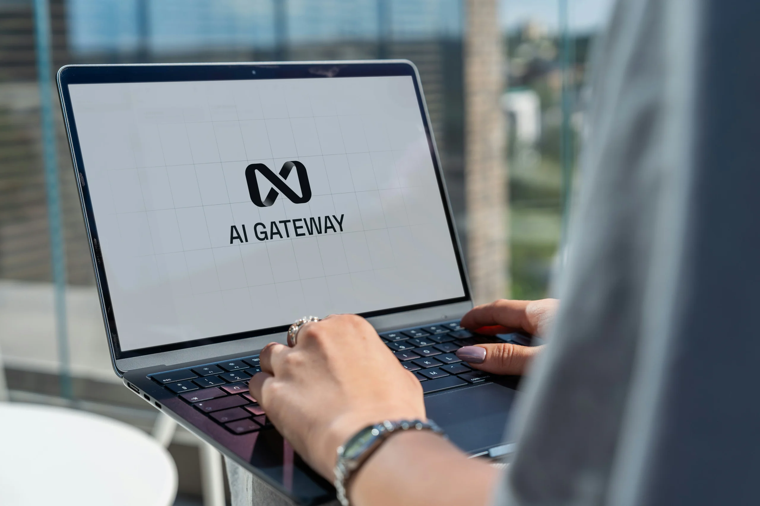 Someone typing on a laptop with the screen showing AI gateway.
